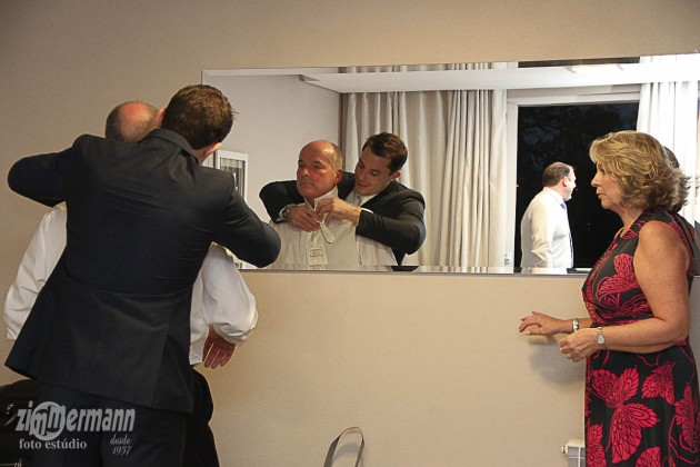Groom getting ready at his parents hotel