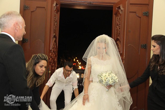 Bride arrives fashionably late with her entourage of hair and make up
