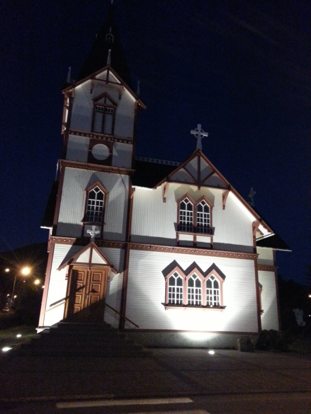 Husavik's main church all lit up at night